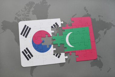 bir dünya haritası arka plan üzerinde güney kore ve Maldivler ulusal bayrağı ile bulmaca.