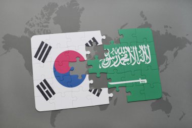 bir dünya haritası arka plan üzerinde Güney Kore ve Suudi Arabistan ulusal bayrağı ile bulmaca.