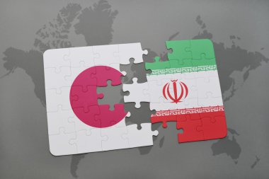 bir dünya haritası arka plan üzerinde Japonya ve İran ulusal bayrağı ile bulmaca.