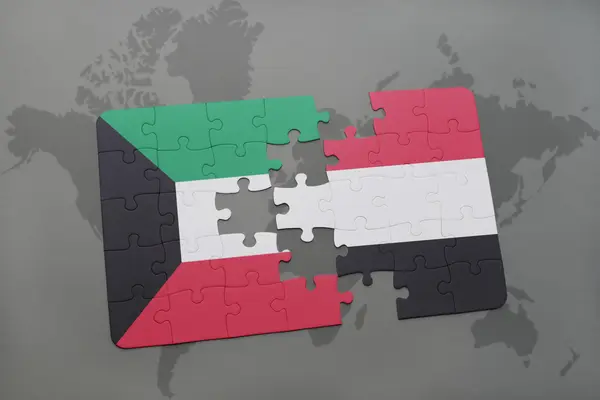 Puzzle with the national flag of kuwait and yemen on a world map background. — Stock Photo, Image