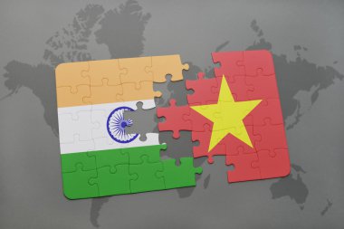 bir dünya haritası arka plan üzerinde Hindistan ve Vietnam ulusal bayrağı ile bulmaca.