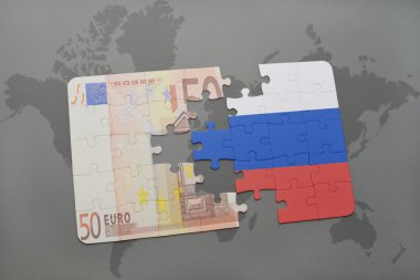 bir dünya haritası arka plan üzerinde rusya ve euro banknot ulusal bayrağı ile bulmaca.