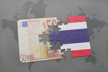 tayland ulusal bayrağı ve bir dünya haritası arka plan üzerinde euro banknot ile bulmaca.