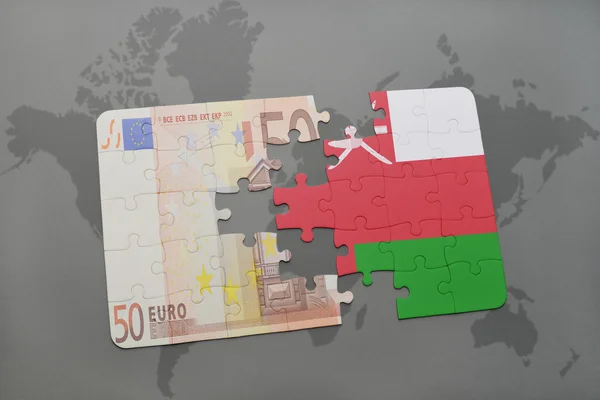 世界地图背景上用阿曼国旗和欧元钞票拼图. — 图库照片
