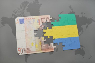 gabon ve euro banknot ulusal bayrağı ile bulmaca bir dünya haritası arka plan üzerinde.