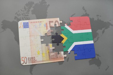 bir dünya haritası arka plan üzerinde güney Afrika ve euro banknot ulusal bayrağı ile bulmaca.