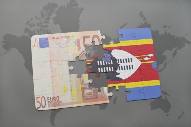 bir dünya haritası arka plan üzerinde svaziland ve euro banknot ulusal bayrağı ile bulmaca.
