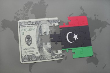 libya ve Doları banknot dünya harita arka plan üzerinde bayrağı ile bulmaca.