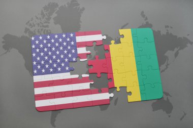 bir dünya haritası arka plan üzerinde Amerika ve Gine birleşik devletleri ulusal bayrağı ile bulmaca.