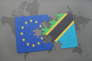 Avrupa Birliği ve Tanzanya dünya harita arka plan üzerinde bayrağı ile bulmaca.