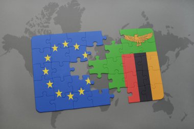 Avrupa Birliği ve Zambiya Dünya harita arka plan üzerinde bayrağı ile bulmaca.