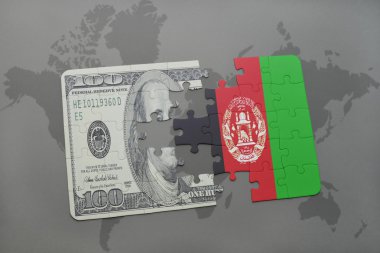 Afganistan ve Doları banknot dünya harita arka plan üzerinde bayrağı ile bulmaca.