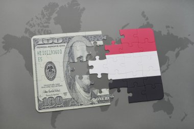 yemen ve Doları banknot dünya harita arka plan üzerinde bayrağı ile bulmaca.