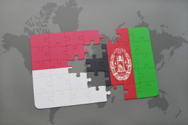 bir dünya haritası arka plan üzerinde Endonezya ve Afganistan ulusal bayrağı ile bulmaca.