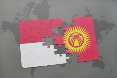 bir dünya haritası arka plan üzerinde Endonezya ve Kırgızistan ulusal bayrağı ile bulmaca.