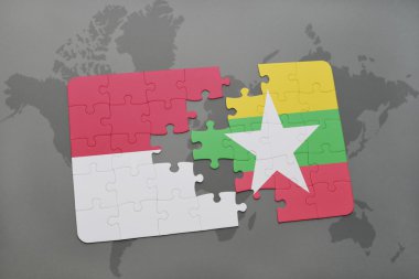 bir dünya haritası arka plan üzerinde endonezya ve myanmar ulusal bayrağı ile bulmaca.
