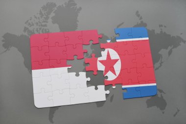 bir dünya haritası arka plan üzerinde Endonezya ve Kuzey Kore ulusal bayrağı ile bulmaca.