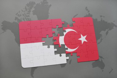 bir dünya haritası arka plan üzerinde endonezya ve Türkiye'nin ulusal bayrağı ile bulmaca.