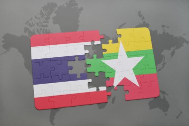 bir dünya haritası arka plan üzerinde tayland ve myanmar ulusal bayrağı ile bulmaca.