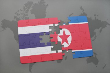 bir dünya haritası arka plan üzerinde Tayland ve Kuzey Kore ulusal bayrağı ile bulmaca.