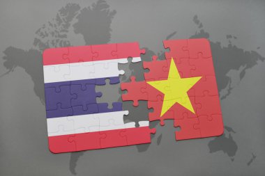 bir dünya haritası arka plan üzerinde Tayland ve Vietnam ulusal bayrağı ile bulmaca.