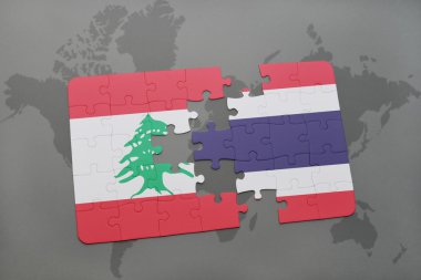 Lübnan ve Tayland ulusal bayrak dünya harita arka plan üzerinde ile bulmaca.
