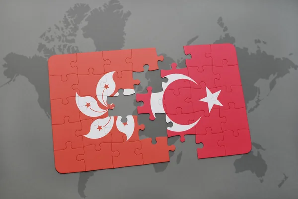 Hong kong ve Türkiye'nin dünya harita arka plan üzerinde bayrağı ile bulmaca. — Stok fotoğraf