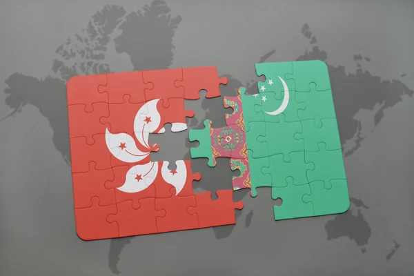 Puzzle con la bandiera nazionale di Hong Kong e Turkmenistan su uno sfondo mappa del mondo . — Foto Stock