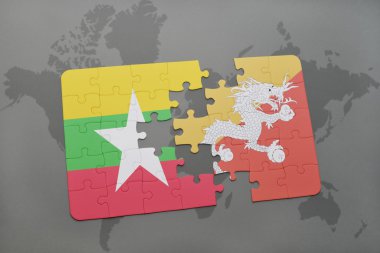 bir dünya haritası arka plan üzerinde myanmar ve bhutan ulusal bayrağı ile bulmaca.