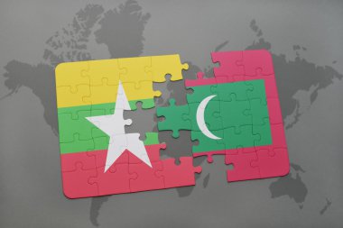 bir dünya haritası arka plan üzerinde myanmar ve Maldivler ulusal bayrağı ile bulmaca.