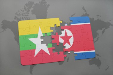 bir dünya haritası arka plan üzerinde myanmar ve kuzey kore ulusal bayrağı ile bulmaca.