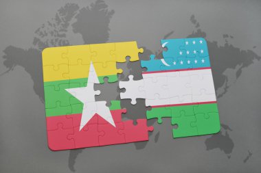 bir dünya haritası arka plan üzerinde myanmar ve özbekistan ulusal bayrağı ile bulmaca.