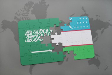 bir dünya haritası arka plan üzerinde Suudi Arabistan ve Özbekistan ulusal bayrağı ile bulmaca.
