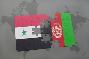 bir dünya haritası arka plan üzerinde Suriye ve Afganistan ulusal bayrağı ile bulmaca.