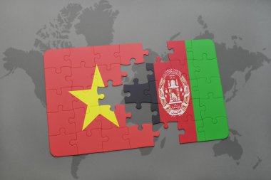 bir dünya haritası arka plan üzerinde Vietnam ve Afganistan ulusal bayrağı ile bulmaca.