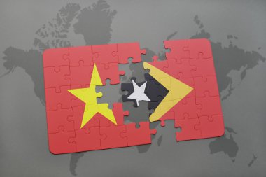 bir dünya haritası arka plan üzerinde vietnam ve doğu timor ulusal bayrağı ile bulmaca.