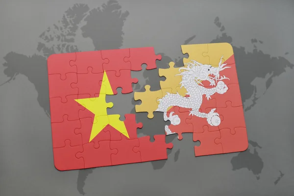 世界地図の背景にベトナムとブータンの国旗とパズル. — ストック写真