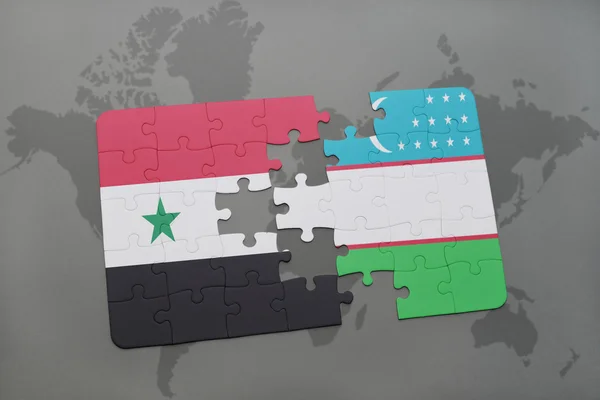 Головоломка з національним прапором Сирії та Узбекистану на карті світу. — стокове фото