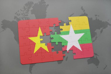 bir dünya haritası arka plan üzerinde vietnam ve myanmar ulusal bayrağı ile bulmaca.