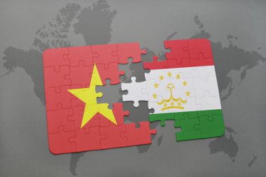 bir dünya haritası arka plan üzerinde vietnam ve tacikistan ulusal bayrağı ile bulmaca.