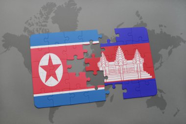 bir dünya haritası arka plan üzerinde kuzey kore ve kamboçya ulusal bayrağı ile bulmaca.