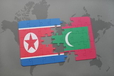 bir dünya haritası arka plan üzerinde kuzey kore ve Maldivler ulusal bayrağı ile bulmaca.