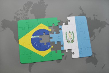 bir dünya haritası arka plan üzerinde Brezilya ve Guatemala ulusal bayrağı ile bulmaca.