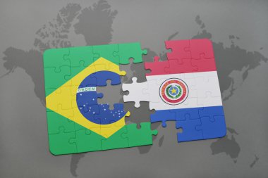 bir dünya haritası arka plan üzerinde Brezilya ve Paraguay ulusal bayrağı ile bulmaca.