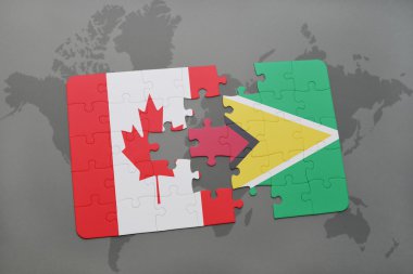 bir dünya haritası arka plan üzerinde kanada ve guyana ulusal bayrağı ile bulmaca.