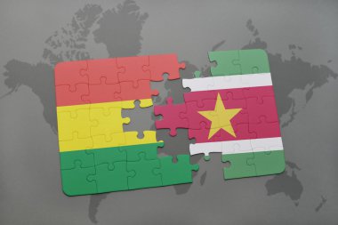 bir dünya haritası arka plan üzerinde bolivya ve surinam ulusal bayrağı ile bulmaca.