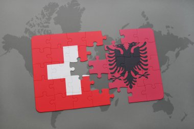 bir dünya haritası arka plan üzerinde İsviçre ve Arnavutluk ulusal bayrağı ile bulmaca.