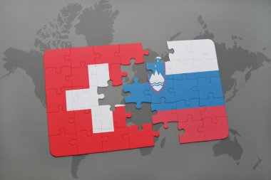 bir dünya haritası arka plan üzerinde İsviçre ve Slovenya ulusal bayrağı ile bulmaca.