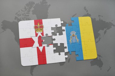 bir dünya haritası arka plan üzerinde kuzey İrlanda ve kanarya adalarıulusal bayrağı ile bulmaca.