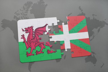 bir dünya haritası arka plan üzerinde galler ve bask ülkesinin ulusal bayrağı ile bulmaca.